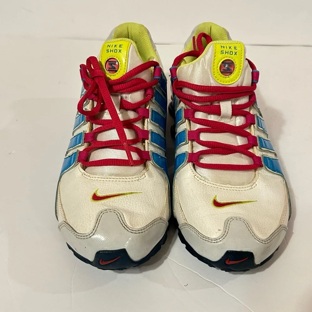 Nike Kids Shox Sneakers in White with Blue, Pink & Neon Yellow Accents